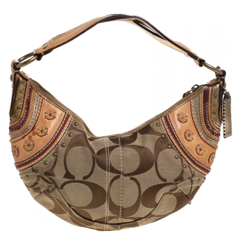 Pre Owned Coach Beige/Tan Signature Canvas and Leather Studded Mia Soho Hobo