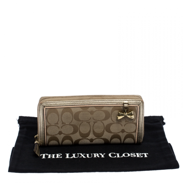 Pre Owned Coach Metallic Gold Signature Canvas Zip Around Wallet