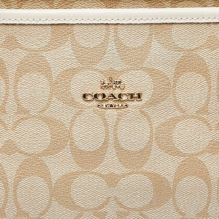 Pre Owned Coach Beige/Brown Signature Coated Canvas and Leather City Zip Tote
