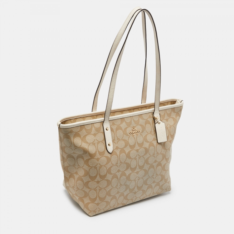 Pre Owned Coach Beige/Brown Signature Coated Canvas and Leather City Zip Tote