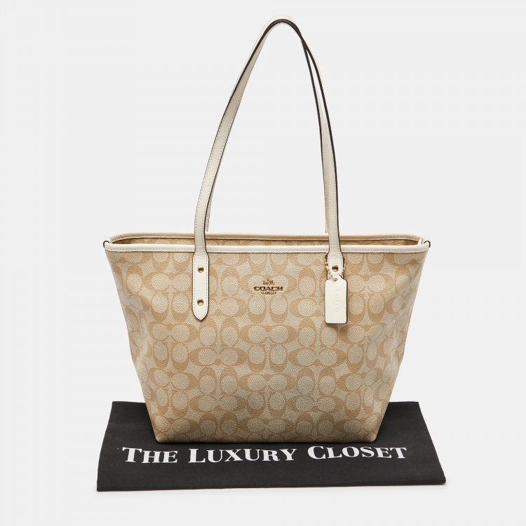 Pre Owned Coach Beige/Brown Signature Coated Canvas and Leather City Zip Tote