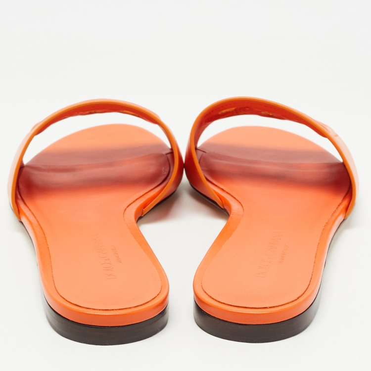 Pre Owned Dolce & Gabbana Orange Leather DG Cut Out Logo Flat Slides Size 37