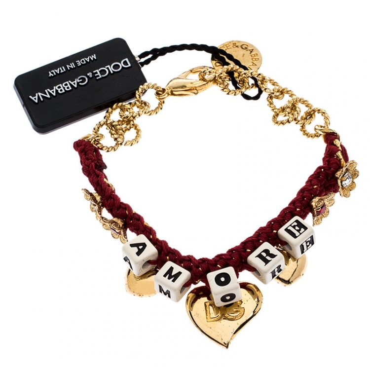 Pre Owned Dolce and Gabbana Amore Red Woven Gold Tone Charm Bracelet