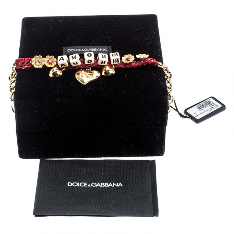 Pre Owned Dolce and Gabbana Amore Red Woven Gold Tone Charm Bracelet