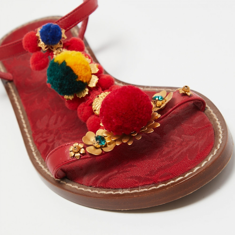 مملوكة مسبقًا Dolce & Gabbana Red Leather Pom Pom and Crystal Embellished Ankle Strap Flat Sandals Size 40