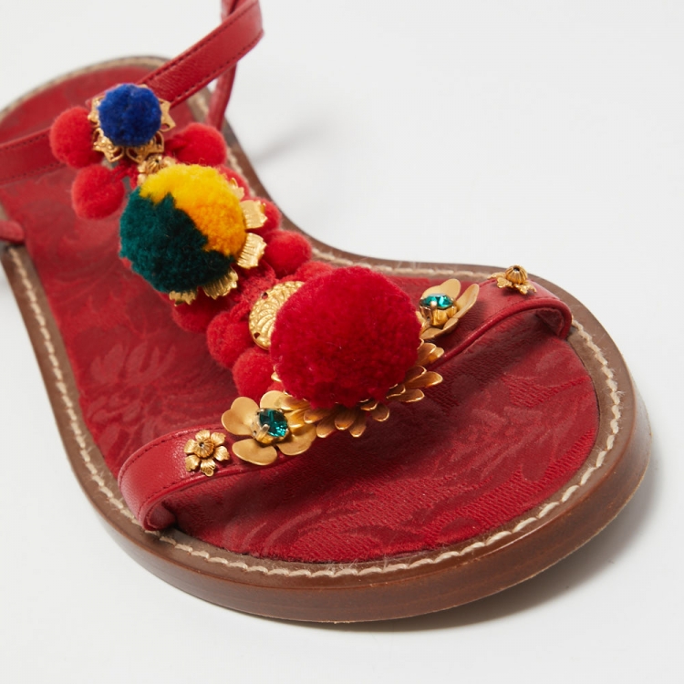 مملوكة مسبقًا Dolce & Gabbana Red Leather Pom Pom and Crystal Embellished Ankle Strap Flat Sandals Size 40
