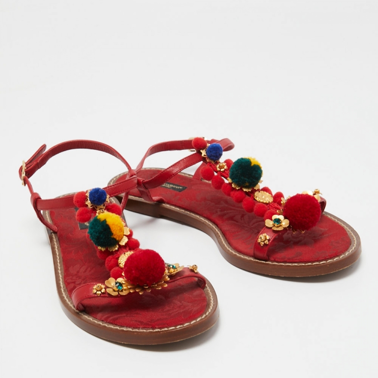 مملوكة مسبقًا Dolce & Gabbana Red Leather Pom Pom and Crystal Embellished Ankle Strap Flat Sandals Size 40