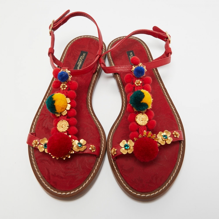 مملوكة مسبقًا Dolce & Gabbana Red Leather Pom Pom and Crystal Embellished Ankle Strap Flat Sandals Size 40