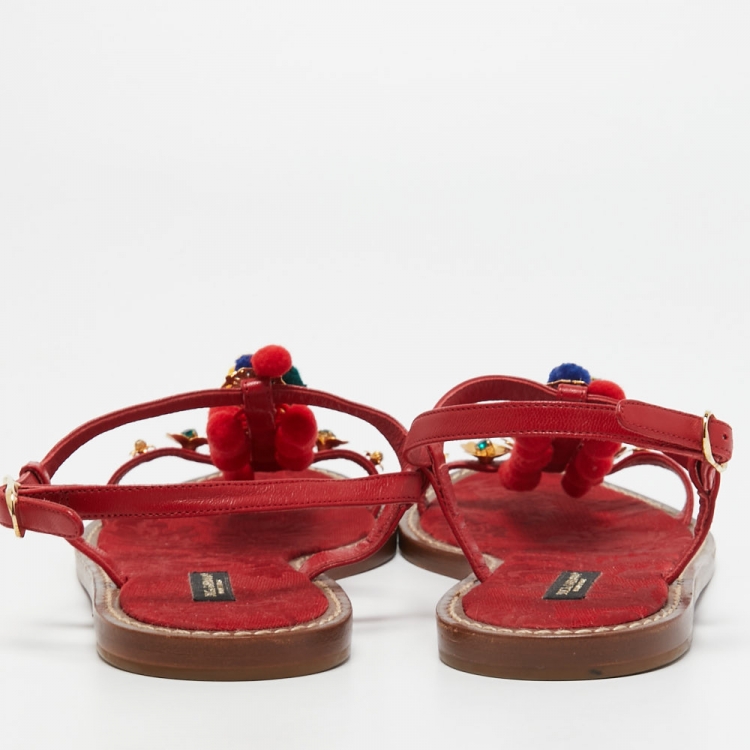 مملوكة مسبقًا Dolce & Gabbana Red Leather Pom Pom and Crystal Embellished Ankle Strap Flat Sandals Size 40