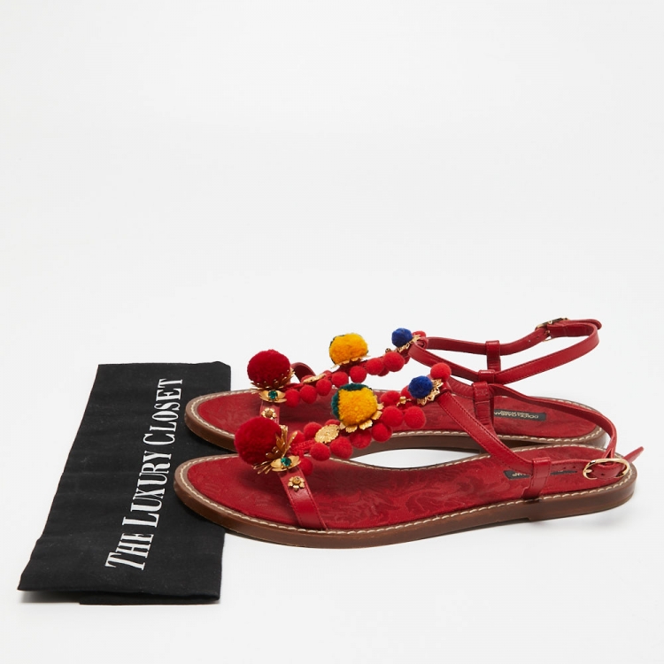 مملوكة مسبقًا Dolce & Gabbana Red Leather Pom Pom and Crystal Embellished Ankle Strap Flat Sandals Size 40