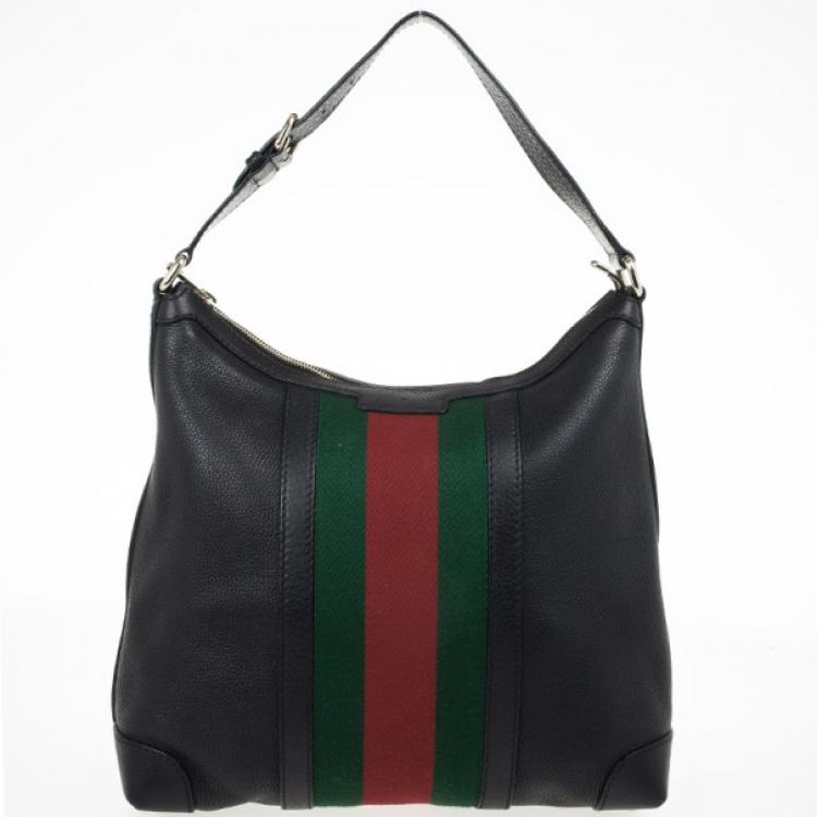 black gucci purse with green and red strap