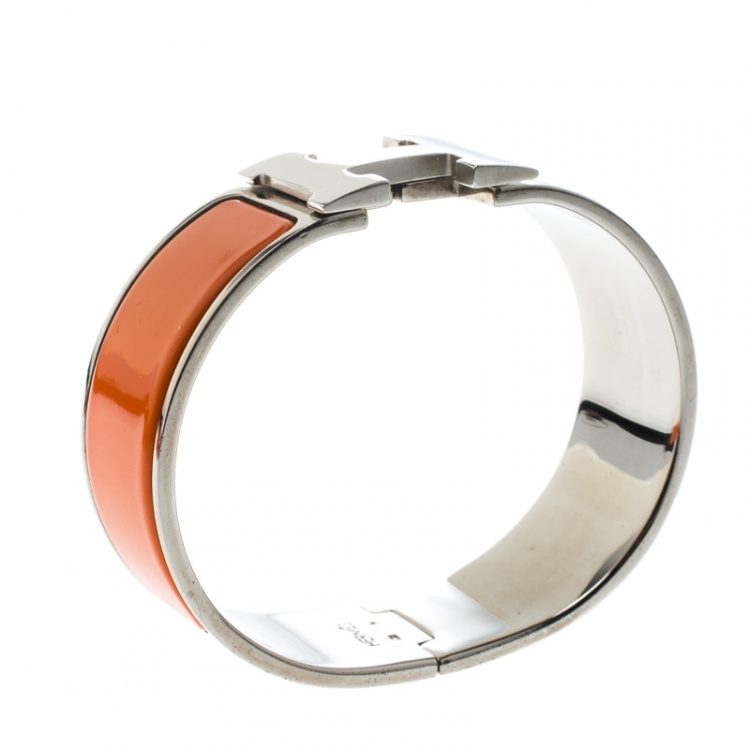 Pre Owned Hermes Clic Clac H Orange Enamel Palladium Plated Wide Bracelet GM