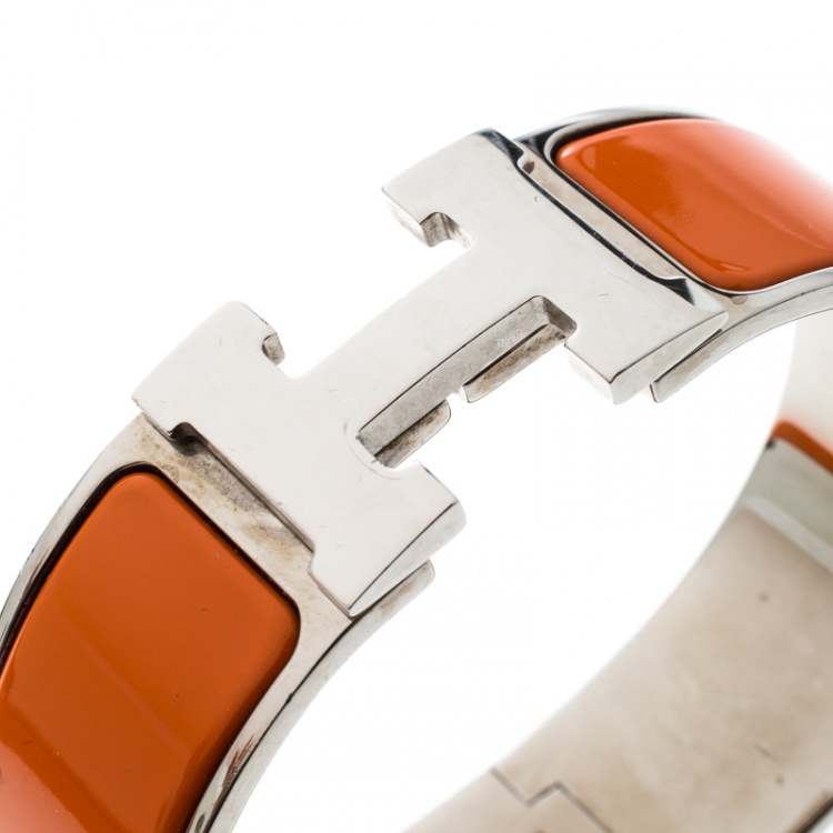 Pre Owned Hermes Clic Clac H Orange Enamel Palladium Plated Wide Bracelet GM