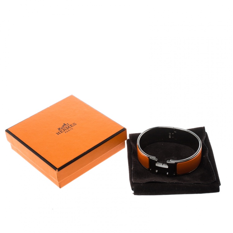 Pre Owned Hermes Clic Clac H Orange Enamel Palladium Plated Wide Bracelet GM