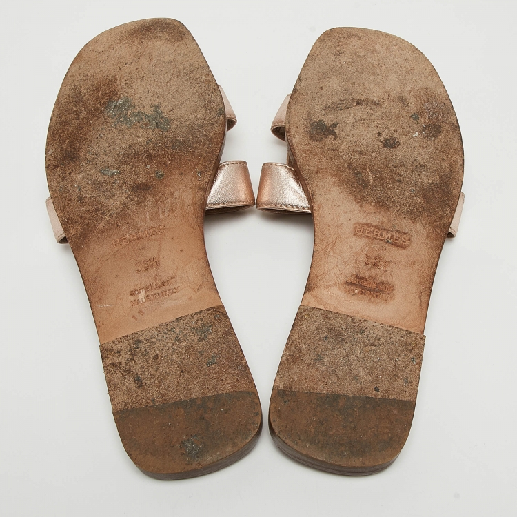 Pre Owned Hermes Metallic Rose Gold Leather Oran Flat Slides Size 36.5
