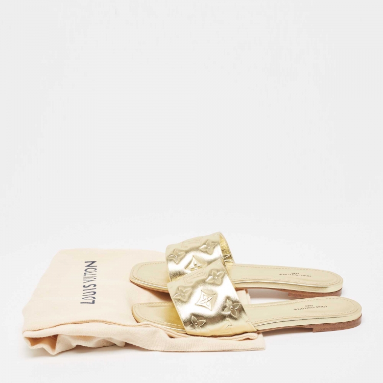 Pre Owned Louis Vuitton Gold Monogram Embossed Leather Revival Flat Slides Size 38