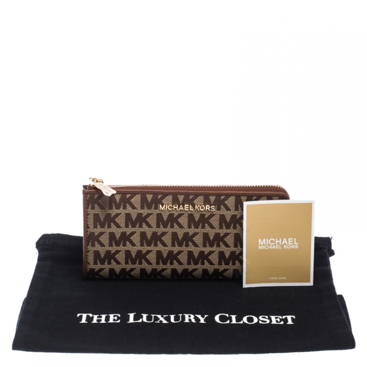 Pre Owned Michael Kors Beige Signature Canvas and Leather Zip Around Wallet