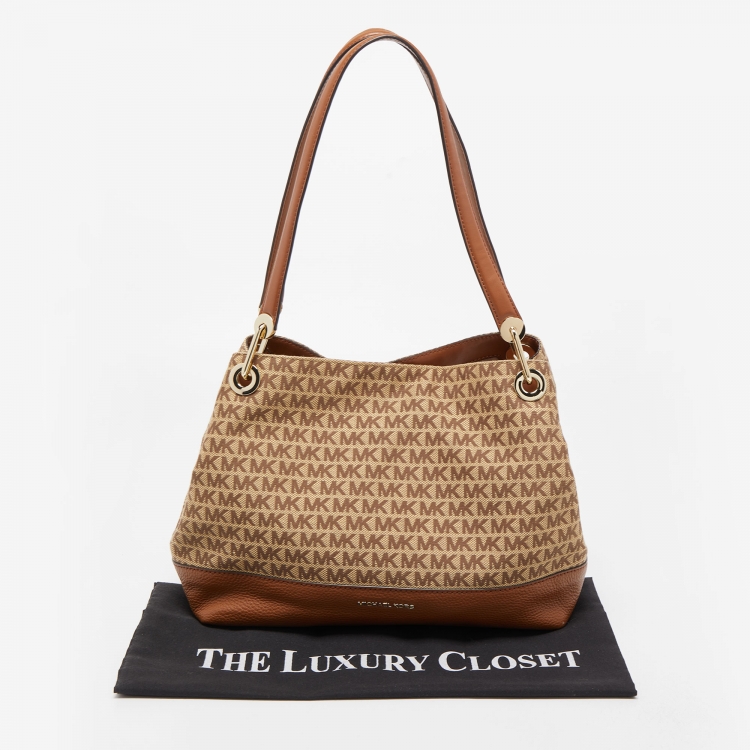 Pre Owned Michael Kors Brown/Beige Signature Canvas and Leather Raven Tote 