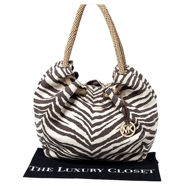 مملوكة مسبقًا MICHAEL Michael Kors Beige Tiger Print Canvas Marina Drawstring Hobo 