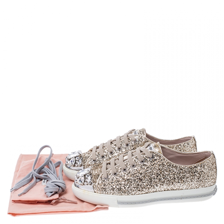 Pre Owned Miu Miu Gold Coarse Glitter Leather Crystal Embellished Cap Toe Lace Up Sneakers Size 36.5