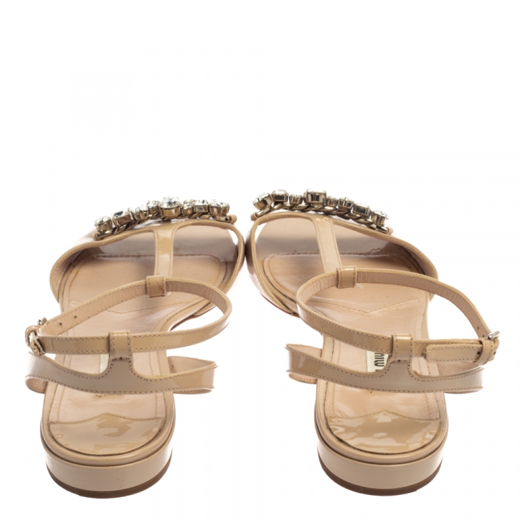 Pre Owned Miu Miu Beige Crystal Embellished Patent Leather T Strap Flat Sandals Size 42