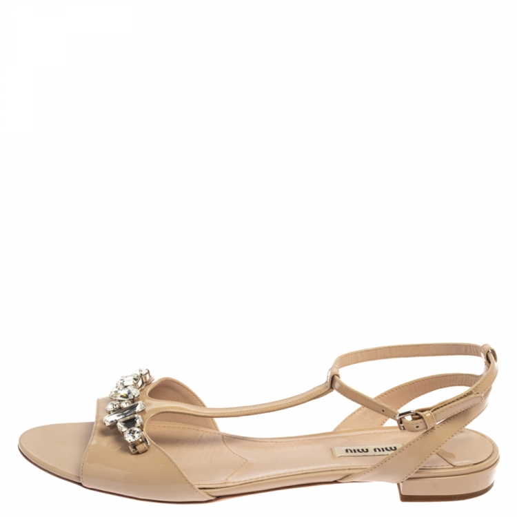 Pre Owned Miu Miu Beige Crystal Embellished Patent Leather T Strap Flat Sandals Size 42