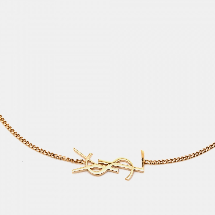 Pre Owned Saint Laurent Paris Gold Tone Opyum Charm Bracelet