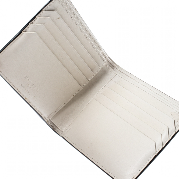 Pre Owned Saint Laurent Off White Leather Fragments East/West Bifold Wallet