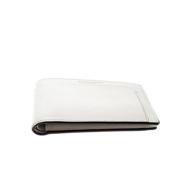 Pre Owned Saint Laurent Off White Leather Fragments East/West Bifold Wallet