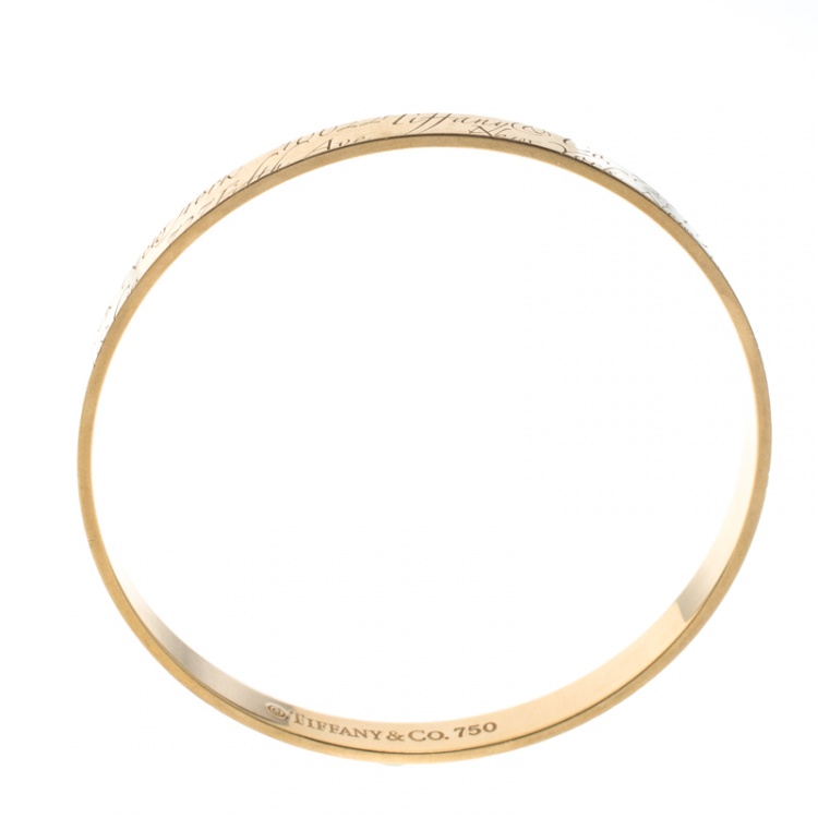 Pre Owned Tiffany & Co. Notes Engraved 18k Yellow Gold Narrow Bangle Bracelet 19cm