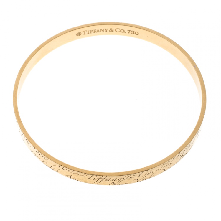 Pre Owned Tiffany & Co. Notes Engraved 18k Yellow Gold Narrow Bangle Bracelet 19cm