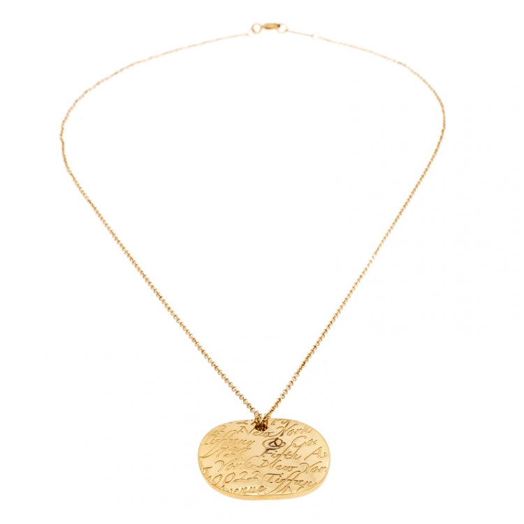 Pre Owned Tiffany & Co. Tiffany Notes Engraved 18k Yellow Gold Round Wave Pendant Necklace