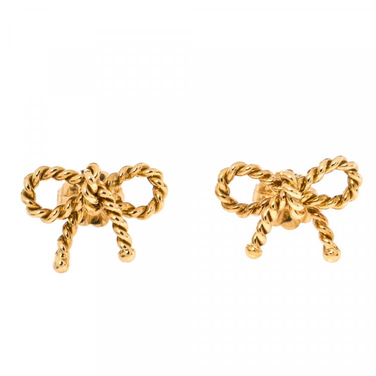 Gold fashion earrings bow shape with zirconium crystals