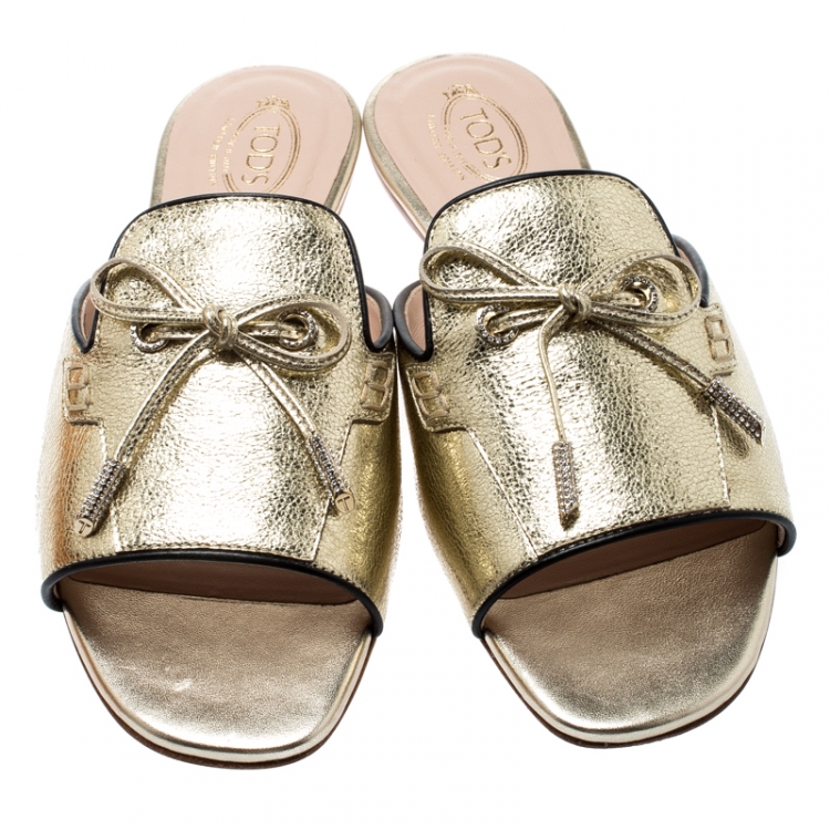 Pre Owned Tod's Limited Edition Metallic Gold Foil Textured Leather Crystal Embellished Bow Detail Flat Slides Size 38