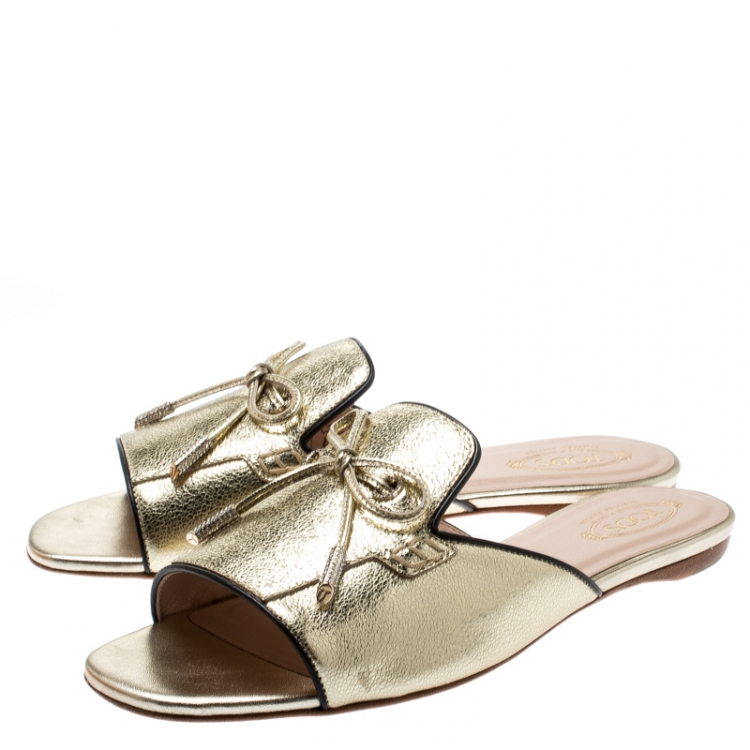 Pre Owned Tod's Limited Edition Metallic Gold Foil Textured Leather Crystal Embellished Bow Detail Flat Slides Size 38