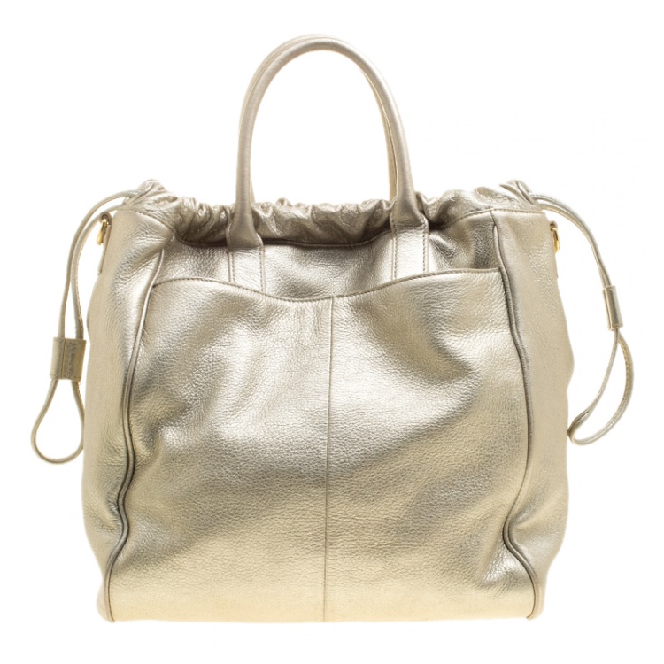 Pre Owned Tory Burch Metallic Silver Leather Perforated Logo Drawstring Tote with Pochette Accessories 