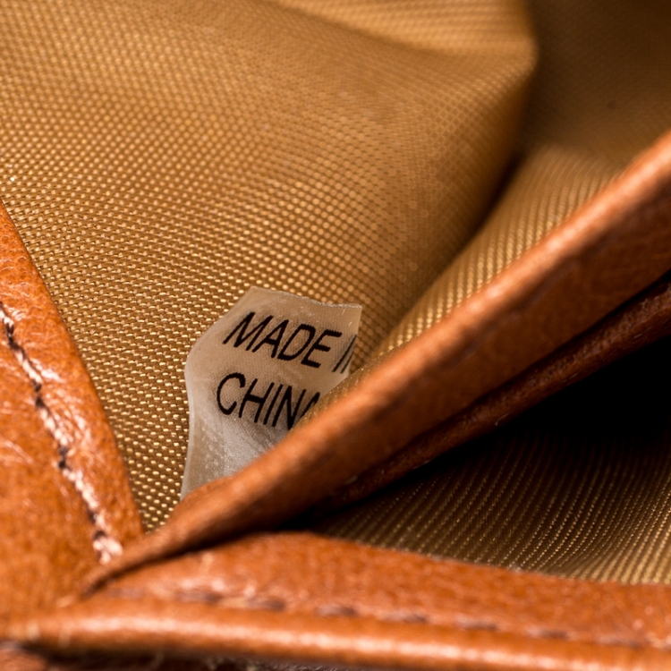 Pre Owned Tory Burch Neon Green Python Embossed Leather Zip Around Wallet