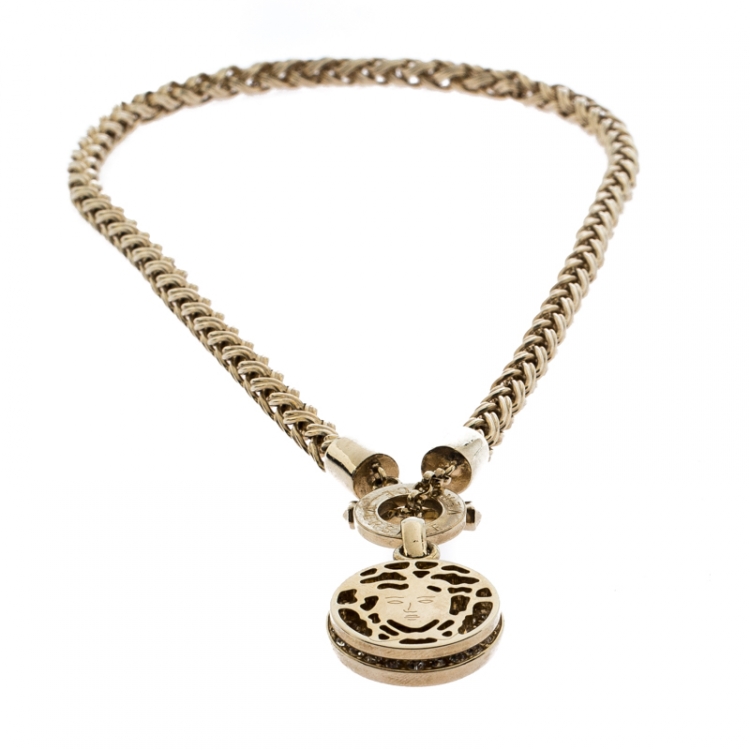 Pre Owned Versace Gold Tone Crystal and Medusa Charm Woven Chain Toggle Necklace 