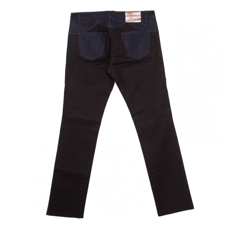 Pre Owned Versace Indigo and Black Dark Wash Denim Paneled Zip Detail Tapered Jeans S