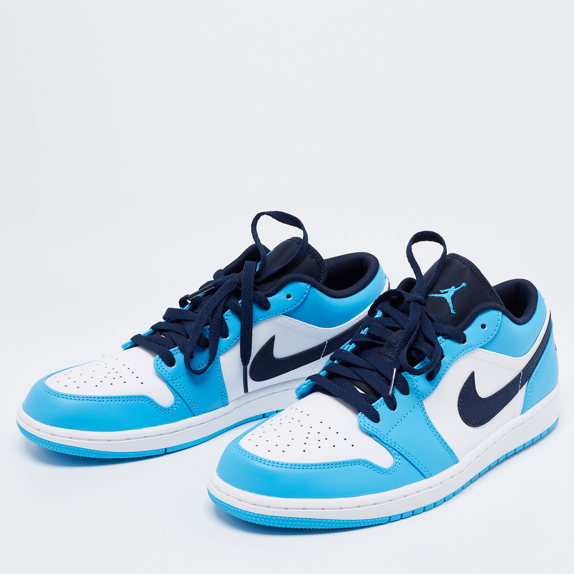 

Nike Air Jordan White/Blue Leather Jordan 1 Retro Low Top Sneakers Size