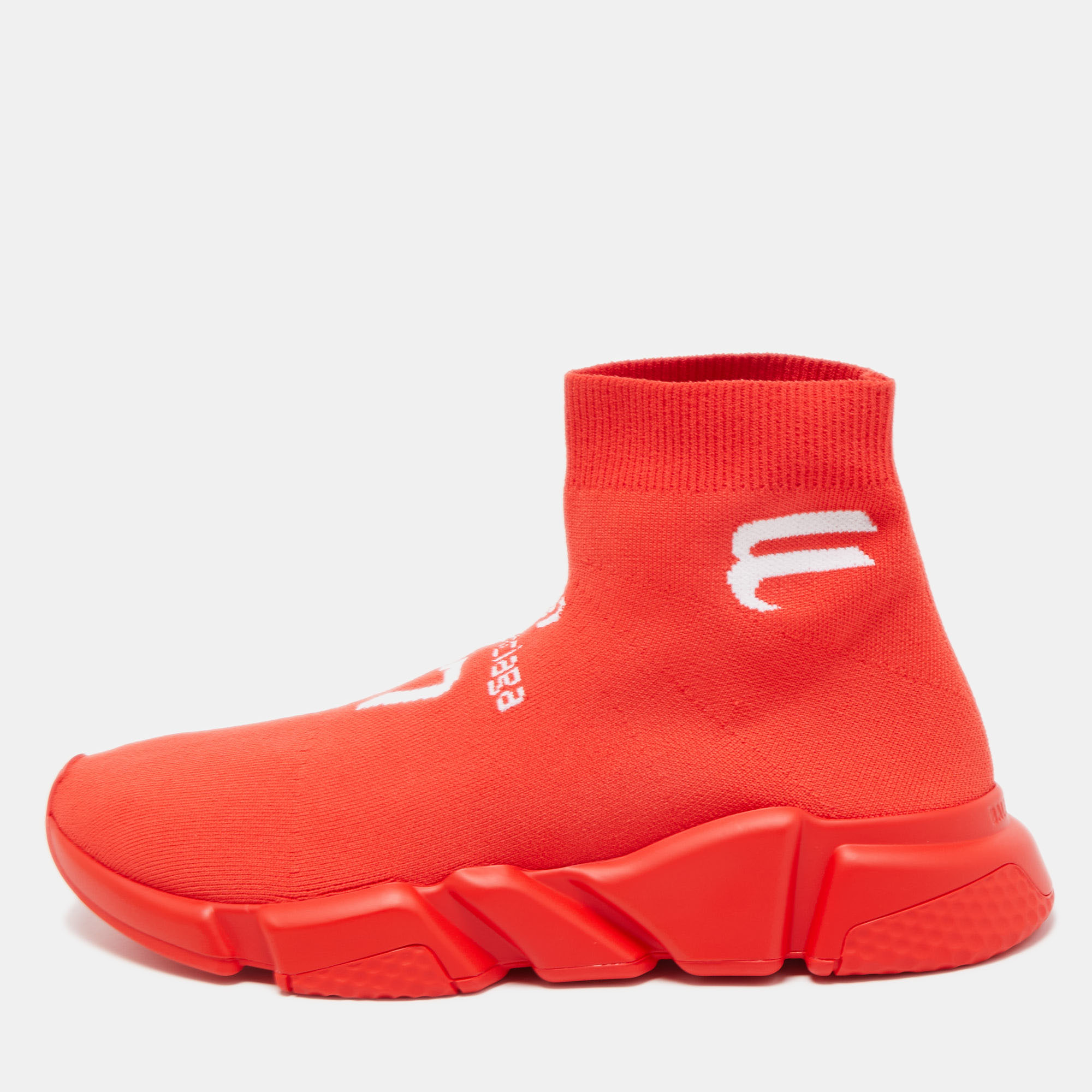 The Balenciaga Speed LT soccer sneakers are a stylish and sporty footwear choice. Crafted with precision these sneakers feature a vibrant red knit fabric upper that provides a snug and comfortable fit. The sleek design is complemented by a lightweight sole making them perfect for both athletic activities and fashion forward streetwear.