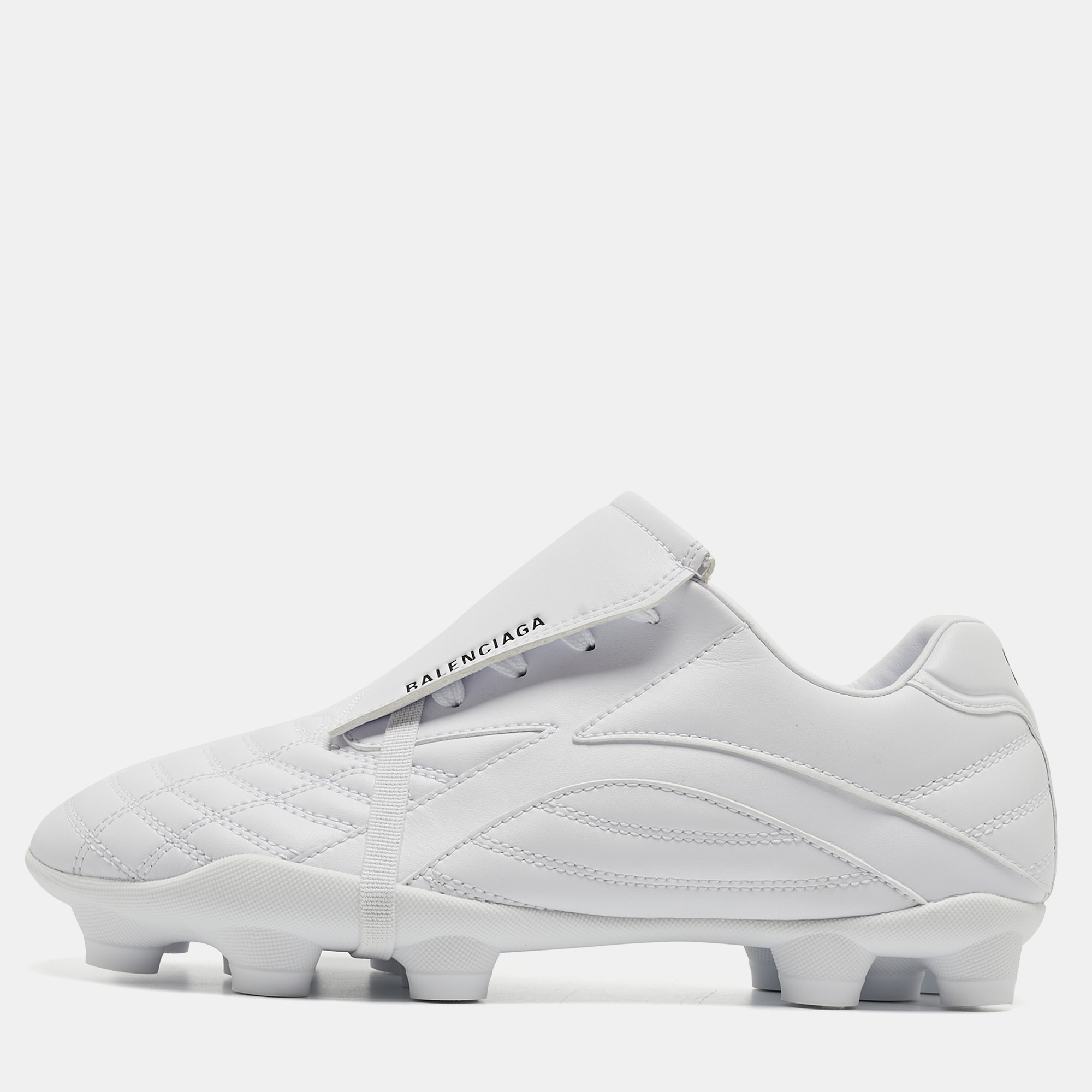 Elevate your casual attire with Balenciagas sneakers. Crafted with precision from high quality faux leather these sneakers exude contemporary charm. The clean white hue adds versatility while the soccer inspired design offers a sporty edge. Effortlessly stylish they blend comfort with urban sophistication.