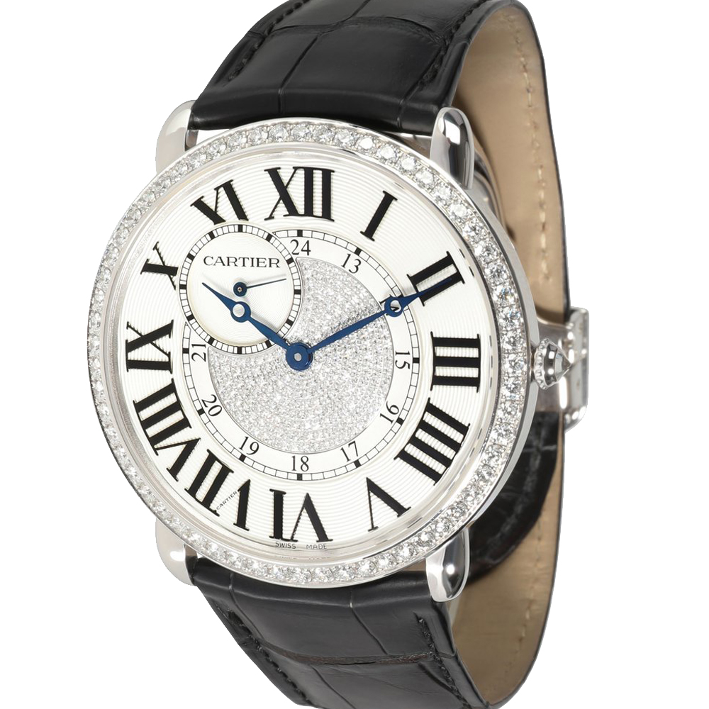 This stunning Cartier Ronde Louis wristwatch will take you from the boardroom to the club in true style. The gorgeous watch features a white dial with Roman numerals and glittering diamonds at its center along with an 18K white gold case and a diamond bezel. A smart black alligator strap adds to the striking design. (Exotic Material the item may be restricted for shipping outside the UAE. Please contact us on info@theluxurycloset. com to check if the item can be shipped to your country)