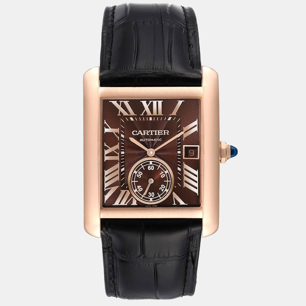 The Tank line by Cartier brings you this beautiful timepiece with a black leather bracelet and a gorgeous case that is strategically weighted. It has a stunning 18k rose gold bezel with a brown dial that has sword shaped arms and Roman numeral hour markers.
