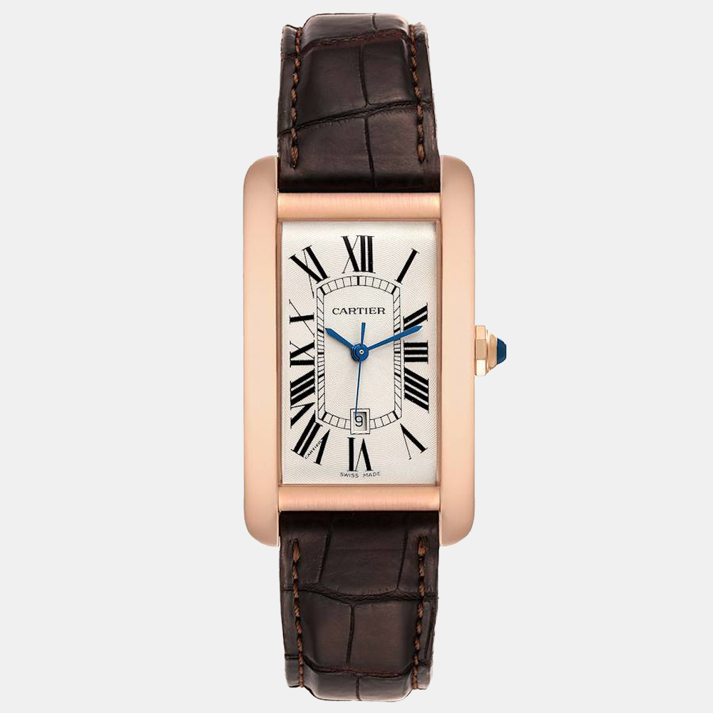 Celebrate success with this stylish Cartier wrist watch that has a tank 18k rose gold case and a matching smooth bezel. It encases a silver guilloche dial which features painted black Roman numerals as hour markers a date window and blue steel sword hands. The watch is secured by a brown leather strap.