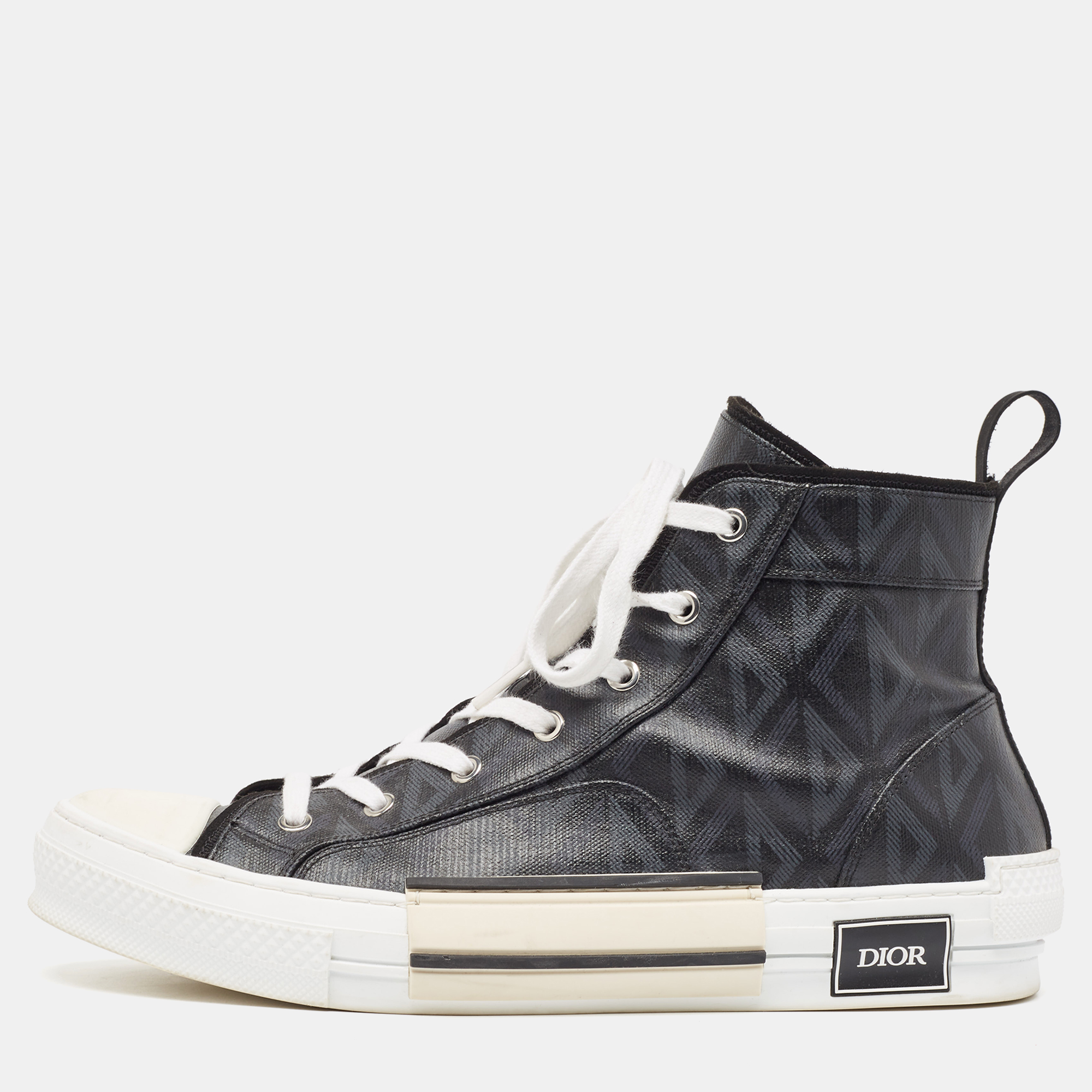 Elevate your footwear game with these Dior high top sneakers. Combining high end aesthetics and unmatched comfort these sneakers are a symbol of modern luxury and impeccable taste.