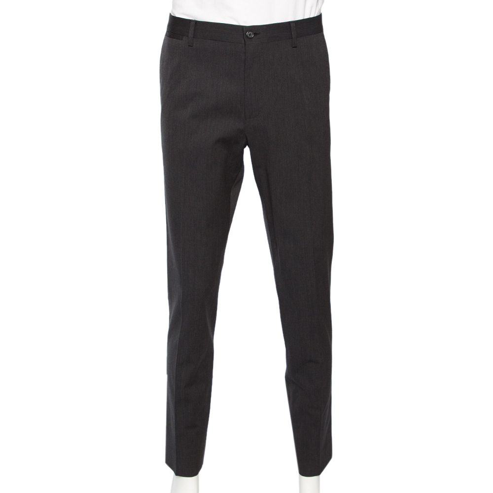 This pair of trousers by Dolce and Gabbana ensures a formal style that is full of comfort. Made of a wool blend the mens trousers in grey feature two pockets belt loops on the waistband and front zip closure.