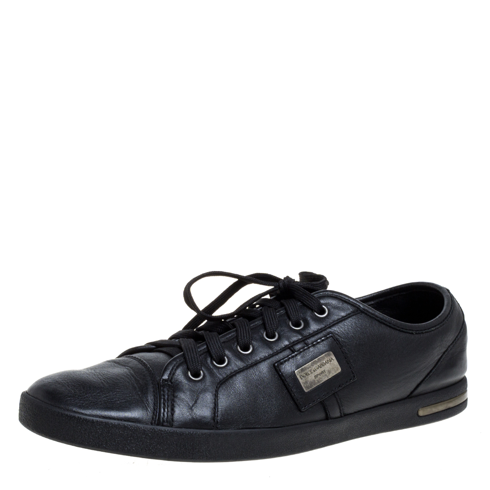 Sturdy and stylish these low top sneakers by Dolce and Gabbana are perfect for a hots of occasions. They have been crafted from quality leather and come in a classic shade of black. They are styled with lace ups logo detailing on the sides silver tone hardware and rubber soles.