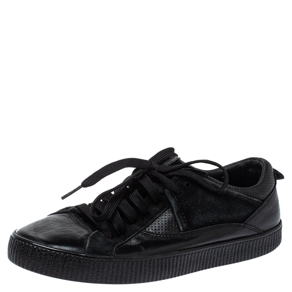 These low top sneakers from Dolce and Gabbana are rendered in black leather and flaunt round toes lace ups on the vamps and brand details on the counters. You will definitely steal a lot of stares when you step out in these comfortable sneakers.