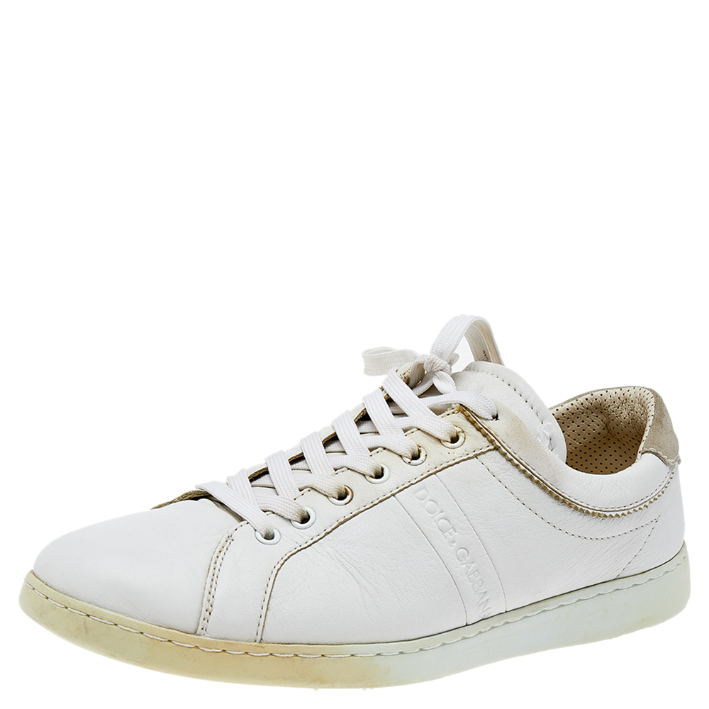 A pair of leather sneakers to lend one all the comfort in this world. These designer sneakers will give you ease in every step. Designed by Dolce and Gabbana they come in white with lace up on the vamps and signature accent on the side.